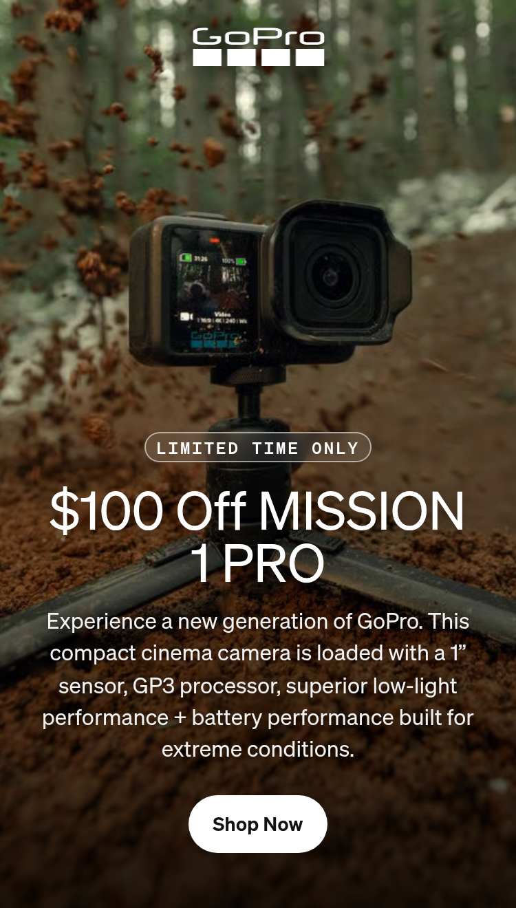 GoPro camera on a tripod capturing dirt spraying on a forest trail.
