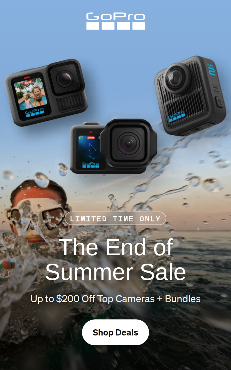 Three GoPro cameras floating above a person snorkeling in the ocean.