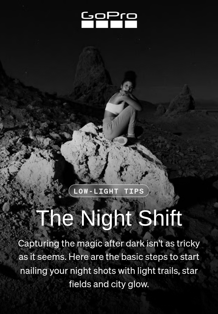 A person crouching on a rock under a night sky in the Eastern Sierras.
